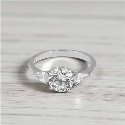 Round cut Solitaire Trilogy Silver Ring with Pair sides